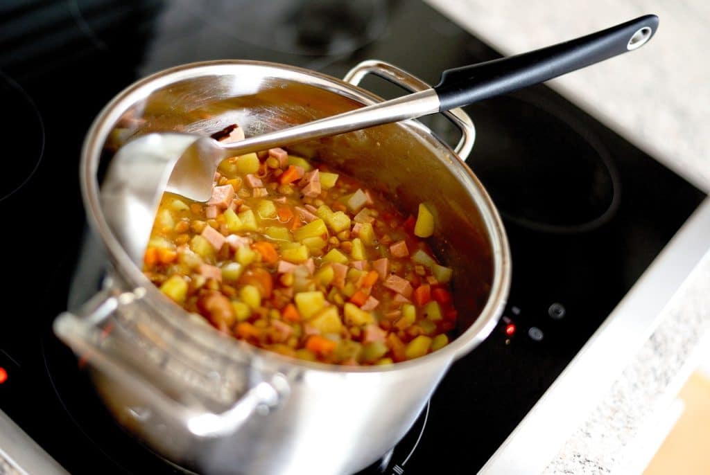 Pot on fire cooking lentils